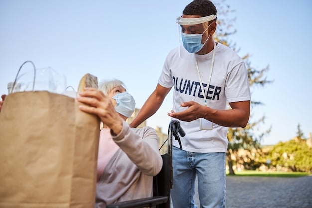 A UN relief worker handing out supplies (food, water, blankets) to people affected by a disaster in the US, showing direct humanitarian aid and support.