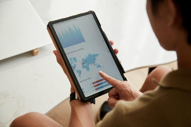 A close-up shot of a tablet displaying a dashboard showing real-time updates on aid distribution in various US states, highlighting key performance indicators (KPIs). The background shows a blurred image of a warehouse with supplies.