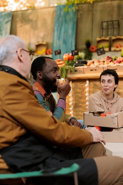 International aid workers meeting with local community leaders in a US city to discuss the needs of the community. The meeting is held in a community center, and participants are engaged in open and respectful dialogue.