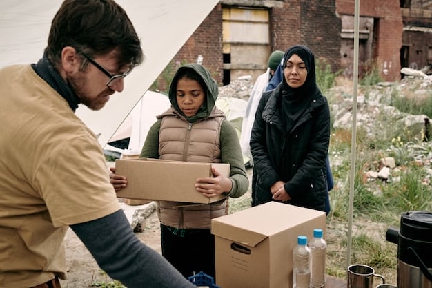 A photo capturing US aid workers distributing supplies and providing assistance to displaced individuals in a refugee camp, highlighting the US commitment to humanitarian relief efforts.