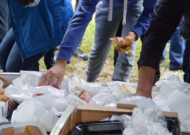 Volunteers distributing bottled water and food supplies to people affected by a flood. The volunteers are handing out supplies from a truck, and the recipients are lining up to receive them. The scene conveys a sense of community support and relief.