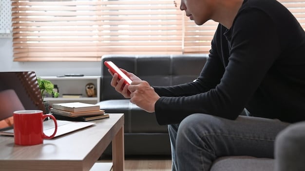 A person signing up for emergency alerts on a laptop, with a smartphone displaying a local alert on a table nearby.